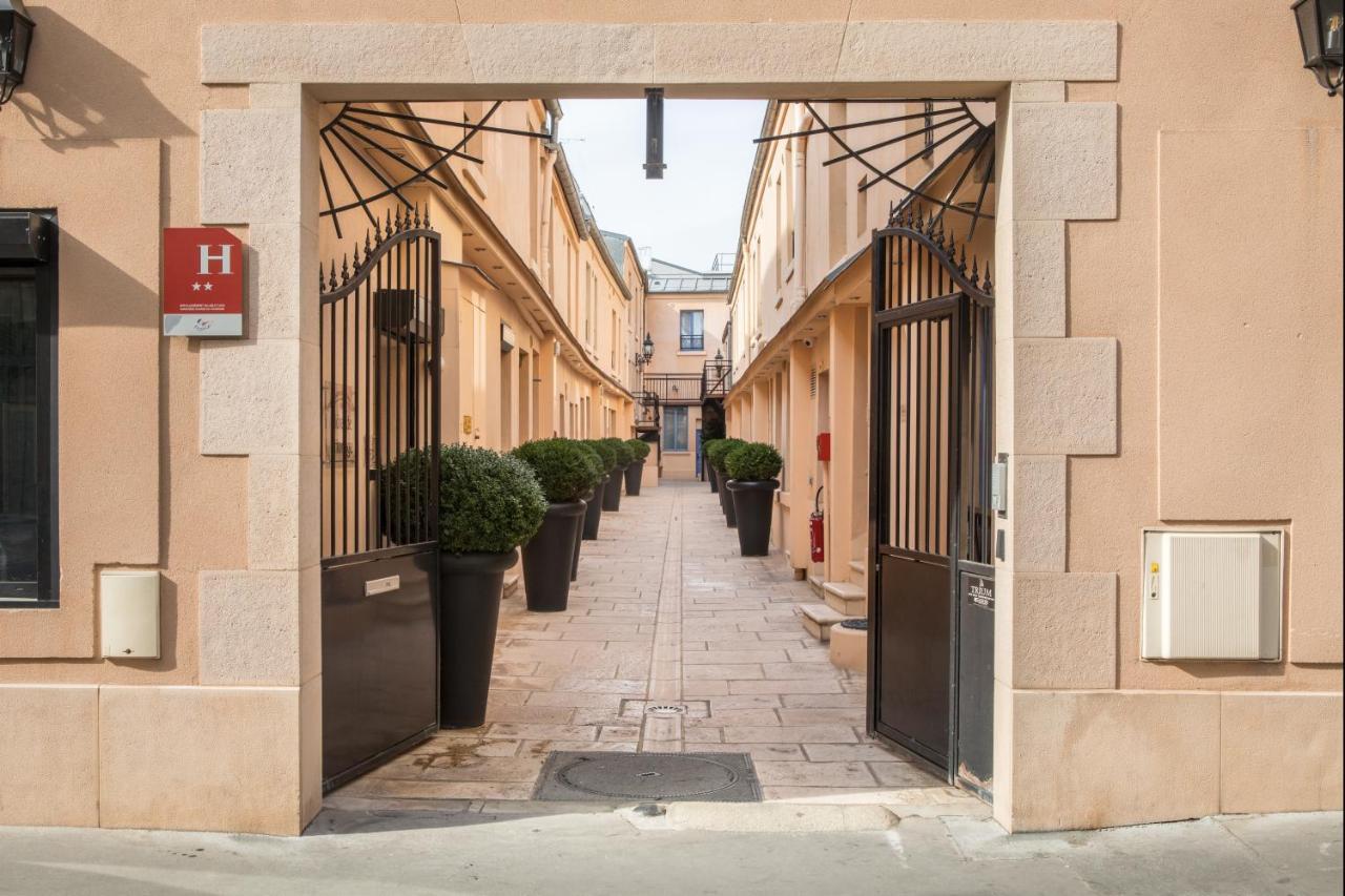 Hotel De L'Horloge Paris Exterior foto